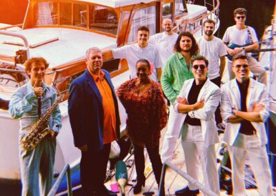 The Yacht Brothers band posing on a yacht