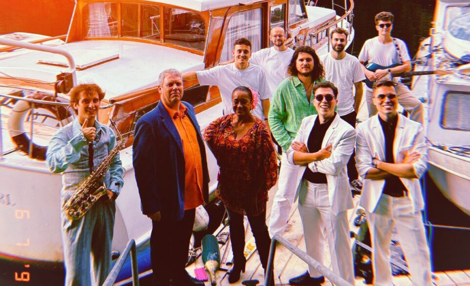 The Yacht Brothers band posing on a yacht